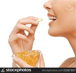 closeup picture of woman with vitamins
