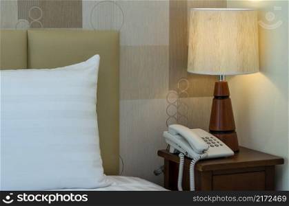 Closeup pillow on the bed with l&in luxury hotel, decorate and safety concept
