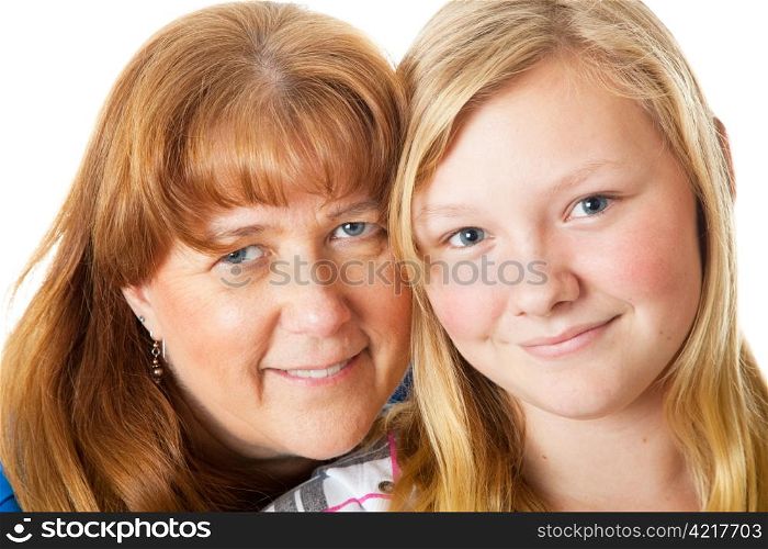 Closeup portrait of a beautiful blond, blue-eyed mother and daughter.