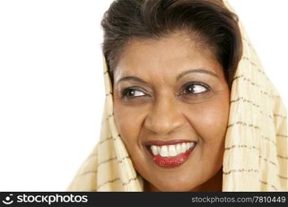 Closeup portrait of a beautiful Indian woman looking away. She has beautiful skin and a beautiful smile.