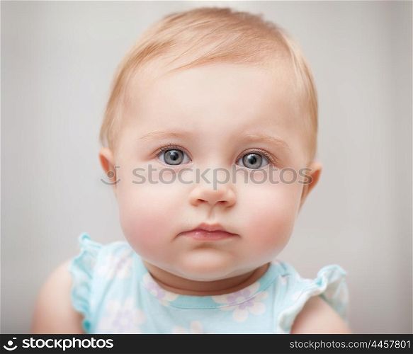 Closeup portrait of a beautiful little baby girl isolated on gray background, carefree childhood, precious innocent kid&#xA;
