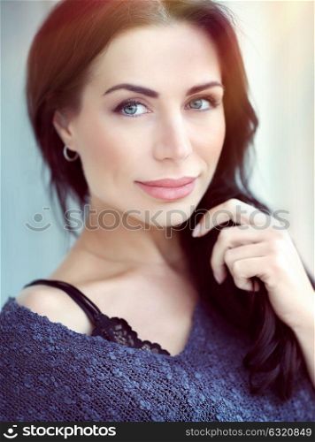 Closeup portrait of a beautiful tranquil brunet woman with day makeup, gorgeous female with perfect authentic appearance, wellbeing and healthy lifestyle, natural beauty