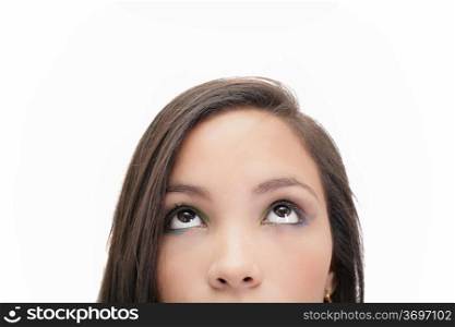 Closeup portrait of a beautiful young woman looking up, isolated on white background
