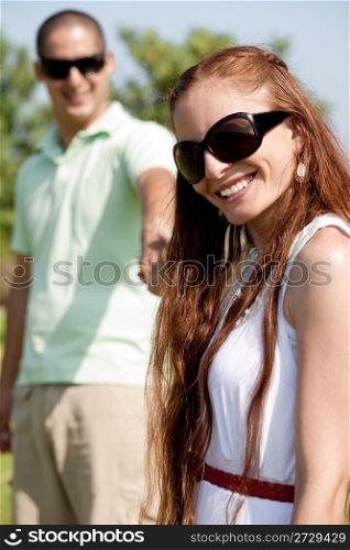 Closeup Portrait Of A Cute Couple, Focus On Female