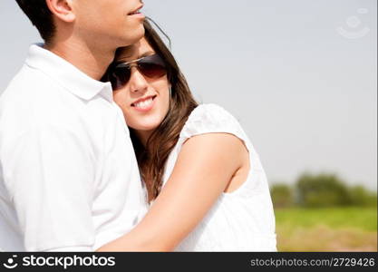 Closeup Portrait Of A Cute Couple Hugging , Focus On Female