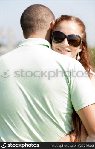 Closeup Portrait Of A Cute Couple Hugging , Focus On Female
