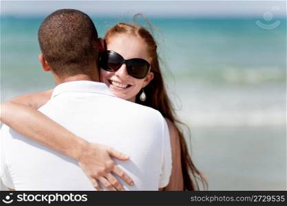 Closeup Portrait Of A Cute Couple Hugging , Focus On Female