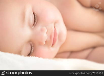 Closeup portrait of a cute sweet little baby sleeping, adorable infant napping, happy healthy childhood, new life concept