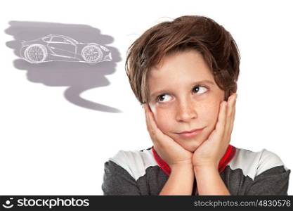 Closeup portrait of a cute teen boy dreaming about a car, thoughtful child isolated on white background, great boyish wish