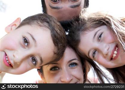 Closeup portrait of a happy family in circle against a white background