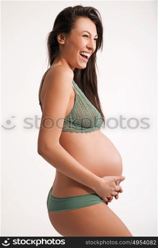 closeup portrait of a happy pregnant woman