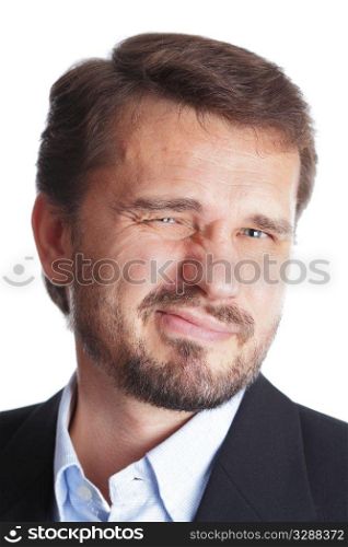 Closeup portrait of a mature businessman making a grimace, isolated over white background