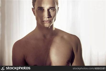 Closeup portrait of a muscular handsome guy