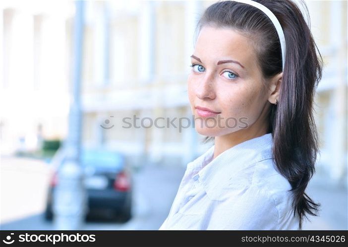 closeup portrait of a woman at sunny street