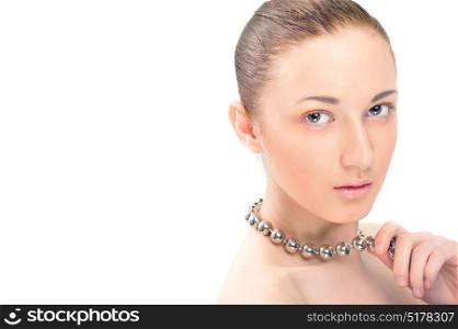 Closeup portrait of a young girl, polished look with pearl necklace