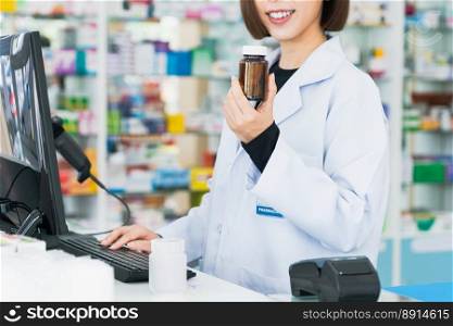 Closeup portrait of a young pharmacist and qualified pharmaceutical, medicine pill container or bottle mockup for copyspace at pharmacy. Drugstore concept with various medicine pills on. Closeup portrait of young asian pharmacist pill bottle at qualified pharmacy.