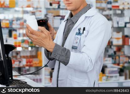 Closeup portrait of a young pharmacist scanning the barcode of a mockup qualified pharmaceutical, medicine pill container or bottle for copyspace at pharmacy.. Closeup portrait young pharmacist scan barcode of mockup qualified pill bottle