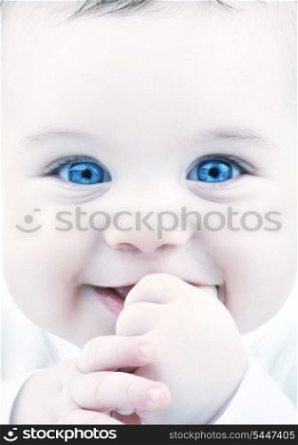 closeup portrait of adorable baby with blue eyes