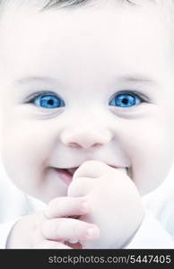 closeup portrait of adorable baby with blue eyes