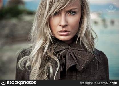 Closeup portrait of an attractive, stylish blond woman