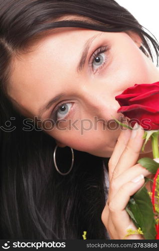 Closeup portrait of an attractive young woman holding a red rose