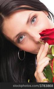 Closeup portrait of an attractive young woman holding a red rose