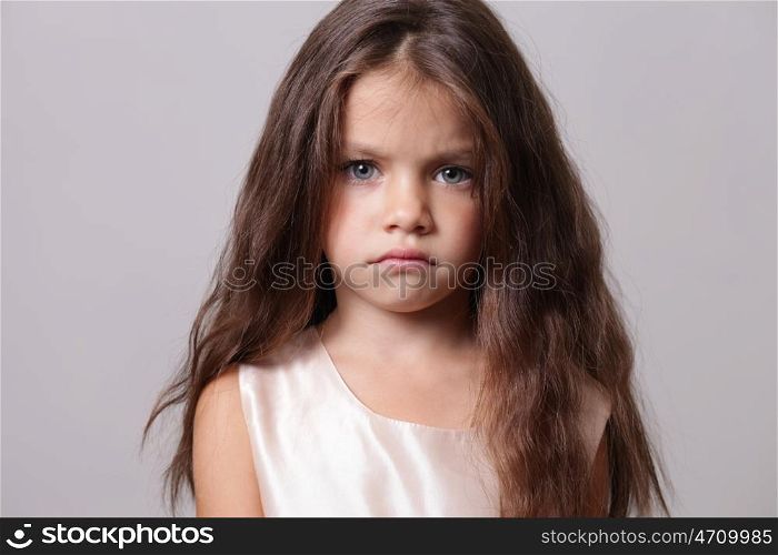 Closeup portrait of angry little girl