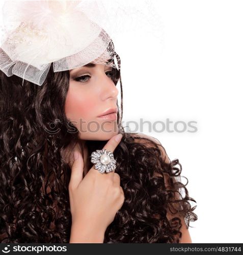 Closeup portrait of attractive female with dark curly hair isolated on white background, bridal look, hat with veil, luxury ring, fashion concept