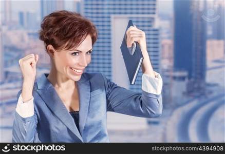 Closeup portrait of attractive happy business woman on city background, successful career, done deal, executive manager, business and success concept