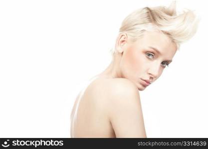 Closeup portrait of beautiful female model with blue eyes on white background