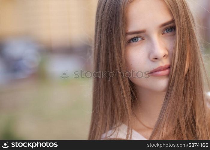 Closeup portrait of beautiful girl outdoors