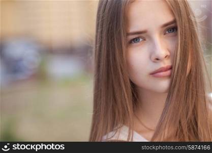 Closeup portrait of beautiful girl outdoors