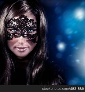 Closeup portrait of beautiful stylish woman wearing mask, luxury New Year party, masquerade in Christmas eve, beauty and fashion concept