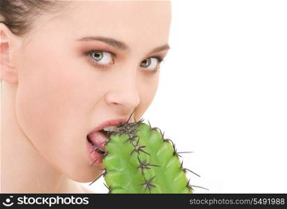 closeup portrait of beautiful woman biting cactus