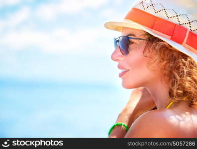 Closeup portrait of beautiful woman wearing stylish sunglasses and hat, side view, having fun outdoors, fashionable and luxury summer vacation