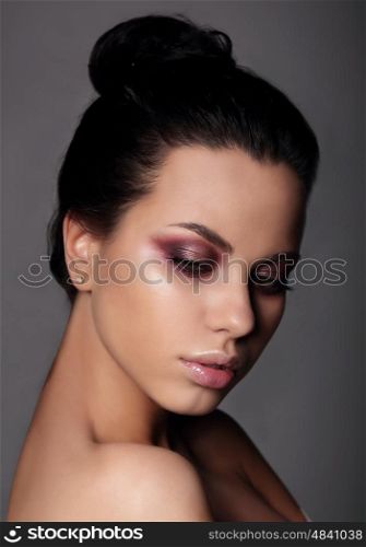 Closeup portrait of beautiful woman with makeup, closed eyes.