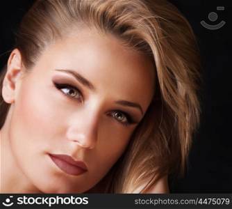 Closeup portrait of beautiful woman with perfect stylish makeup isolated on black background, attractive model after beauty salon