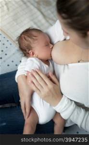 Closeup portrait of breastfeeding her little baby