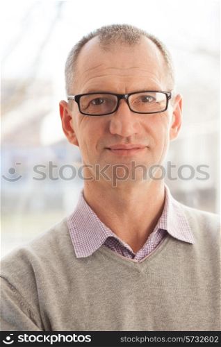 Closeup portrait of casual style adult man in glasses