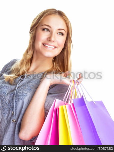 Closeup portrait of cute blond girl holding in hands paper bags isolated on white background, enjoying shopping, happy consumer concept