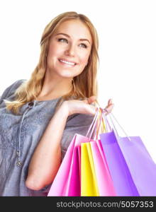 Closeup portrait of cute blond girl holding in hands paper bags isolated on white background, enjoying shopping, happy consumer concept