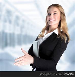 Closeup portrait of cute girl holding laptop and stretches out her hand for a handshake with business partner, make a deal concept
