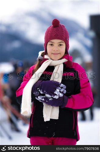 Closeup portrait of cute smiling woman posing against high Alps