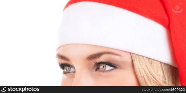 Closeup portrait of cute woman wearing red Santa hat isolated on white background, half face of girl with beautiful eyes, Christmas holidays concept&#xA;