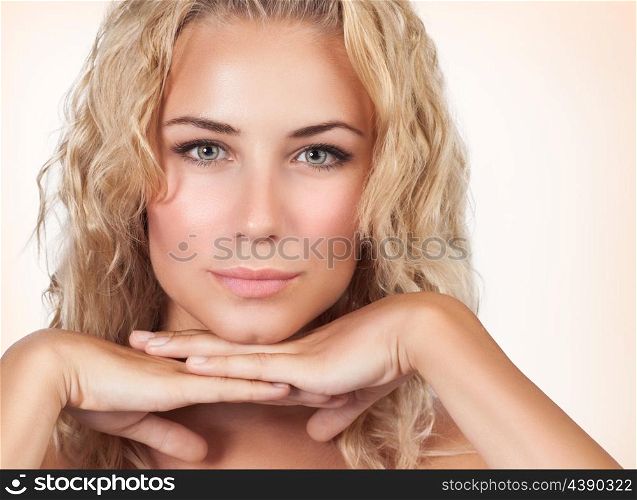 Closeup portrait of gentle female with perfect clear skin over beige background, healthy lifestyle, luxury beauty salon