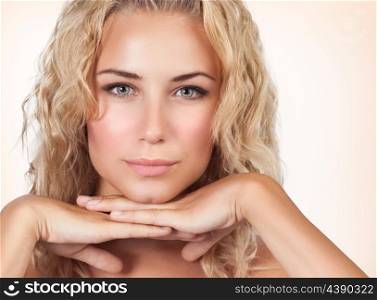 Closeup portrait of gentle female with perfect clear skin over beige background, healthy lifestyle, luxury beauty salon