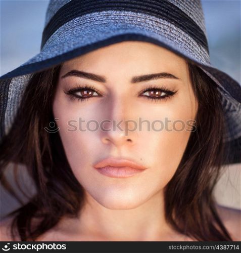 Closeup portrait of gorgeous beautiful arabic woman with perfect makeup wearing stylish hat, fashion and beauty