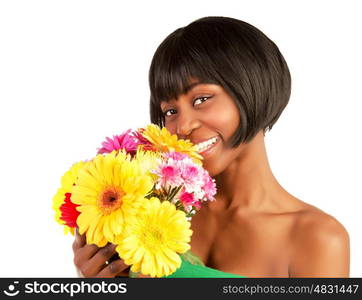 Closeup portrait of gorgeous female with black skin holding in hands great colorful gerber flowers