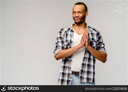 Closeup portrait of happy young handsome african-american man rubbing hands together in anticipation.. Closeup portrait of happy young handsome african-american man rubbing hands together in anticipation