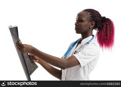 Closeup portrait of intellectual african woman healthcare doctor with white labcoat, looking at brain x-ray radiographic image, ct scan, mri, isolated white background. Radiology department